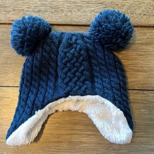 Blue toddler hat with poms